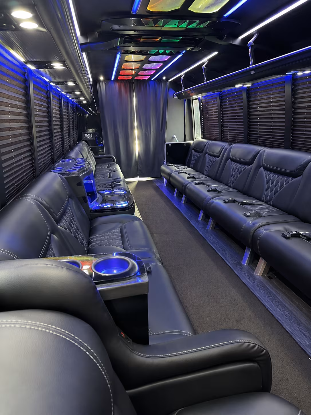 Friends laughing during a party bus celebration in Lafayette